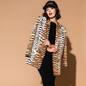 Dressed in LALA Tiger blazer with matching LALA trucker hat